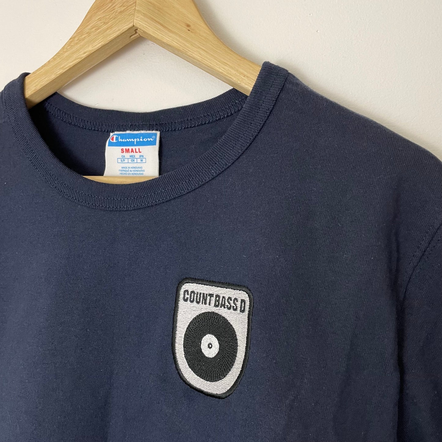 Champion Embroidered Count Bass D Logo Tee Navy Blue